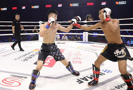 中国狠人汤丰客场三战全速KO制霸勇夺无限制格斗60KG级金腰带！